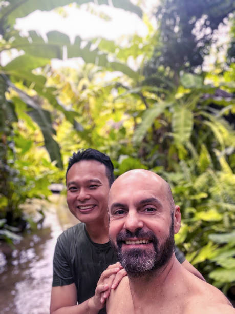 istock Gay couple having fun in nature. 1406593557