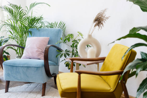 istock Two vintage armchairs surrounded by indoor plants 1406593609