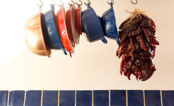 istock Santa Fe Style: Chili Pepper Ristra Hangs with Kitchen Pots 1406594685