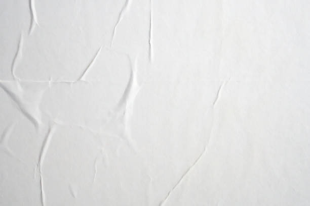 istock white crumpled and creased paper poster texture background 1406605335