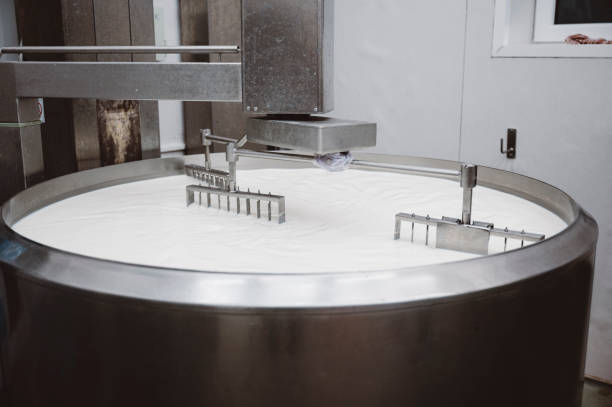 istock Milk being mixed in a large pot 1406605446