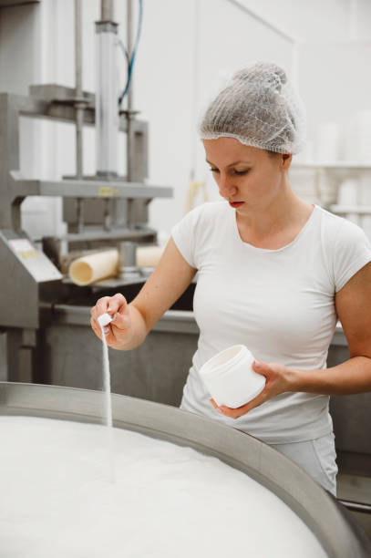 istock Woman adding salt to the milk 1406605459