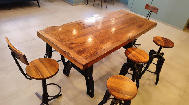 istock rectangular wooden table with round seat chairs in bright clean modern coworking space - brainstorming workspace seen from above 1406609755