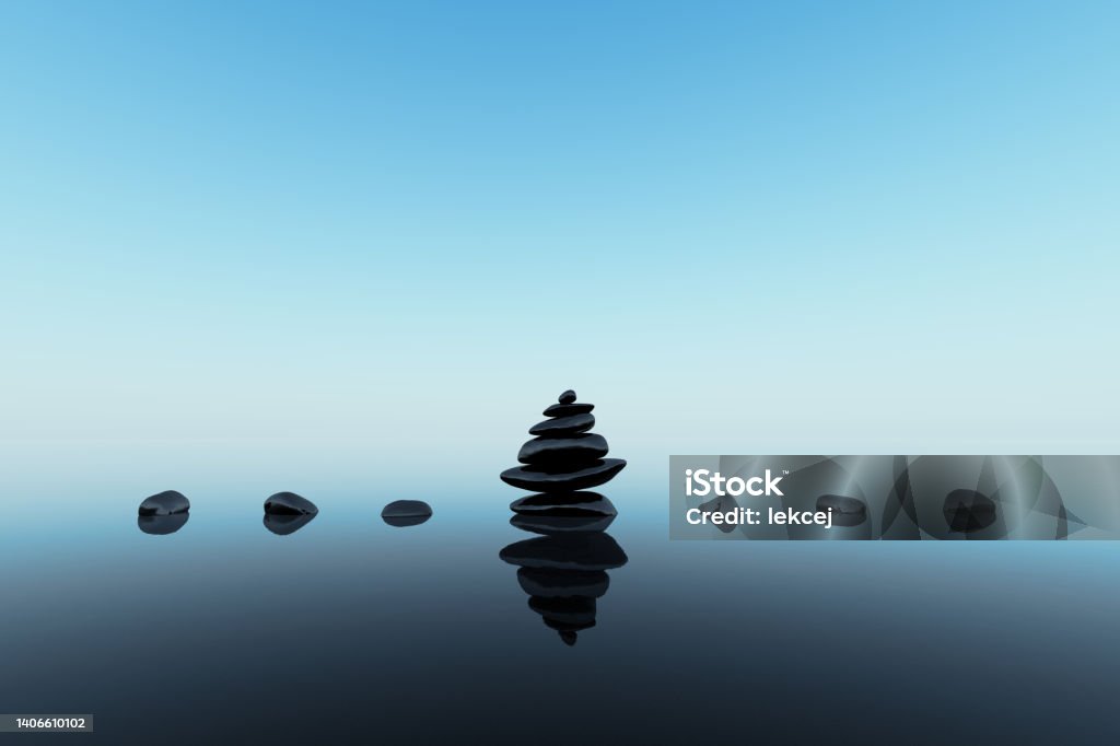 stacked black stones stacked black stones with reflections on blue clean background Balance Stock Photo