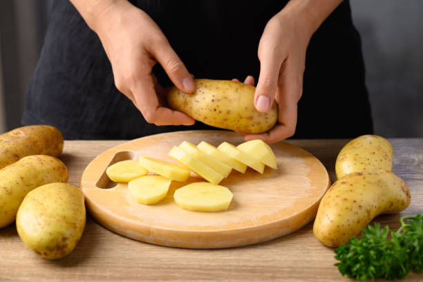 Sliced potatoes for cooking, Food ingredients stock photo