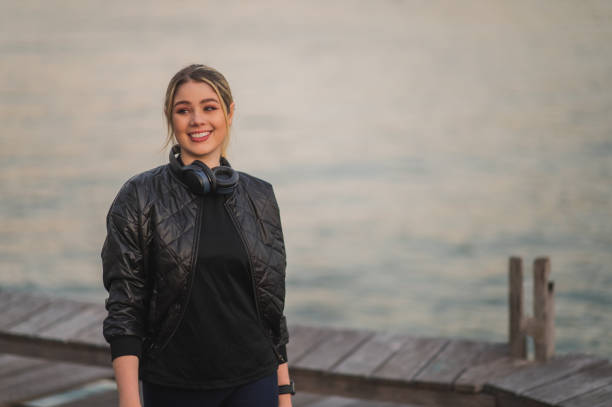 istock woman running outdoors by the sea 1406617529