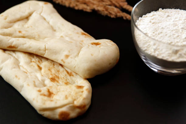 istock Nan made from wheat to eat with Indian curry on the table 1406620872