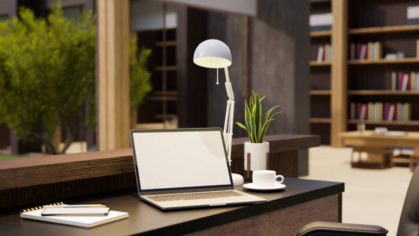 istock Stylish comfortable home office studio interior with notebook laptop white screen mockup 1406627853