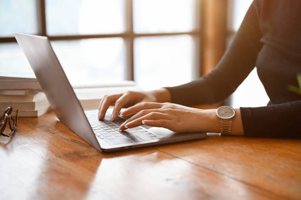 istock Businesswoman or female using a portable laptop computer. cropped image 1406628956