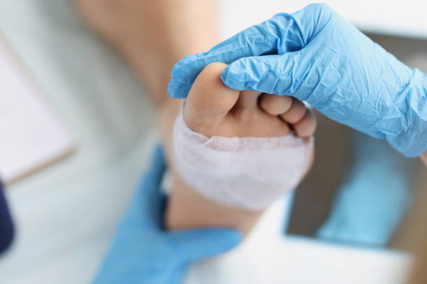 Doctor conducts medical examination of foot with patch Doctor conducts medical examination of foot with patch. Pain attacks concept human joints medical stock pictures, royalty-free photos & images