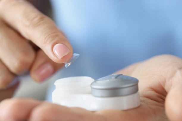 istock Soft contact lens and lens storage box closeup 1406633272