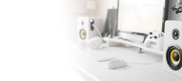 istock White modern wired gaming mouse in a white comfortable gamer workspace. Close-up of a special device 1406633994