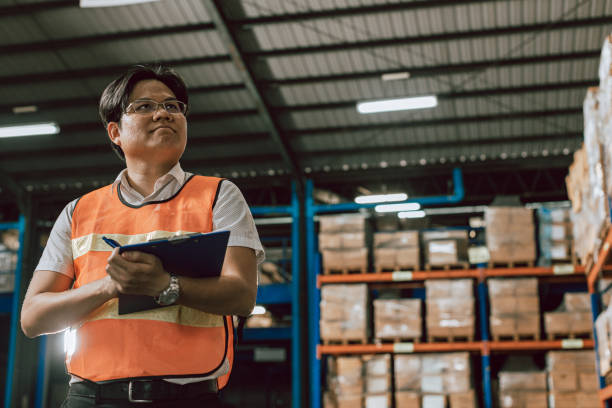 istock Warehouse staff portrait, asia. 1406635348