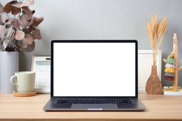 istock Blank screen laptop on working desk decor with stationery at home 1406639145