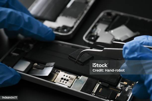 Technician Repairing The Cell Phone Parts And Tools For Recovery Repair Phone Smartphone Stock Photo - Download Image Now