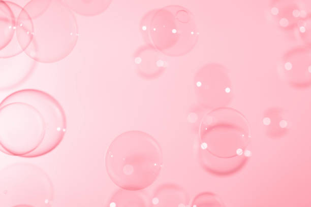 istock Abstract Beautiful Transparent Pink Soap Bubbles Background. Soap Sud Bubbles Water 1406652536