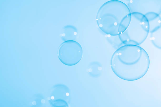 istock Abstract Beautiful Transparent Blue Soap Bubbles Background. Soap Sud Bubbles Water 1406652537
