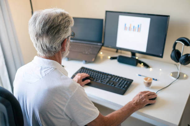 istock Senior man working from home on a remote job in a home office 1406652644