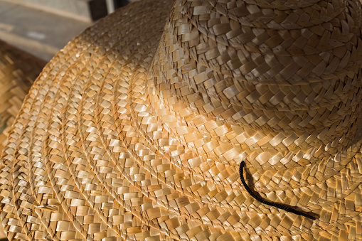 A straw hat woven of straw