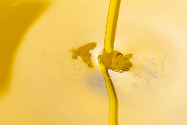 istock Close-up of olive oil flowing down 1406655217