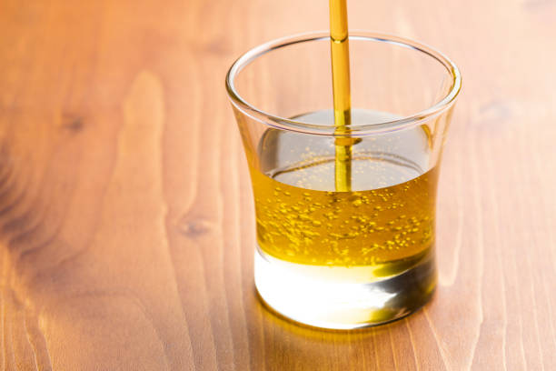 Close-up of olive oil flowing down