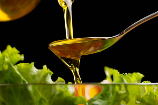 istock Eat tomato and lettuce salad with olive oil. 1406655323