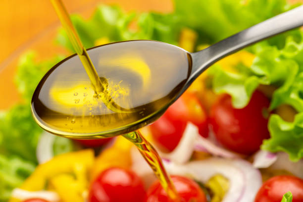 istock Eat tomato and lettuce salad with olive oil. 1406655330