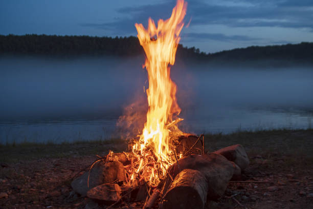 the flames of the fire on the shore