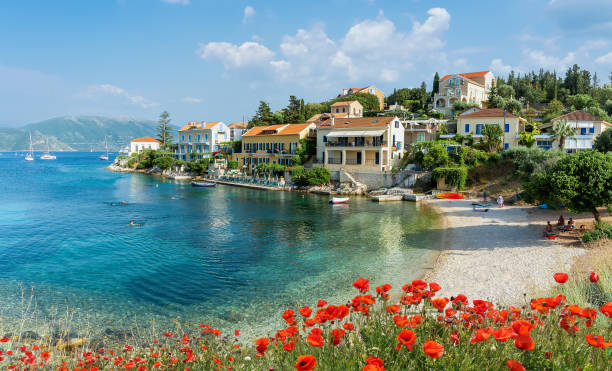 Landscape witn Fiskardo village on Kefalonia, Greece Landscape witn Fiskardo village and Zavalata beach on Kefalonia, Ionian island, Greece kefalonia stock pictures, royalty-free photos & images