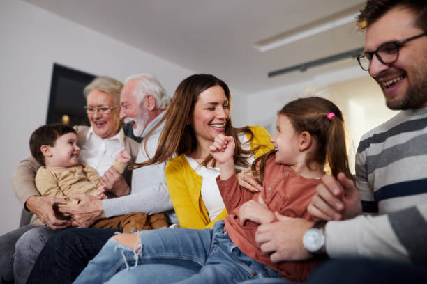 istock Playful extended family having fun at home. 1406660189