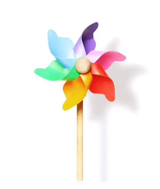 Photo of Colored pinwheel or windmill on white background