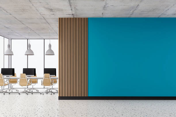 Empty office interior with copy space and work desks on terrazzo floor and paneled wall