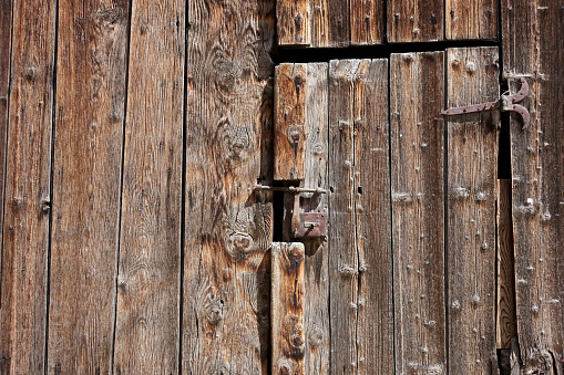 Antique wooden stable door, Italian alps.