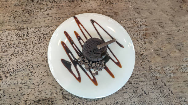 istock Close up photo of chocolate cake on white dish 1406663876