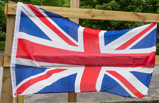 Union Flag on a pub car park fence in Haworth to commemorate Queen Elizabeth II platinum jubilee.