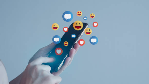 istock Social media and digital online concept, woman using mobile smart phone for chat on internet with emoji smile, heart, message comment icon. Living on vacation and playing social media. 1406669942