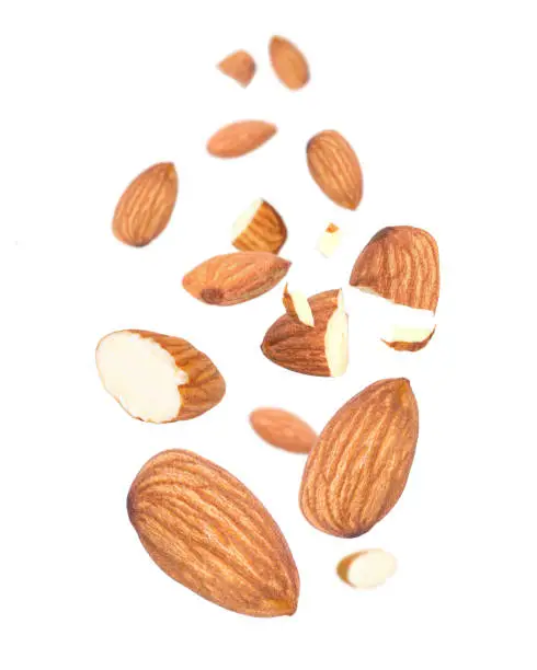 Almond nut flying in the air isolated on white background.