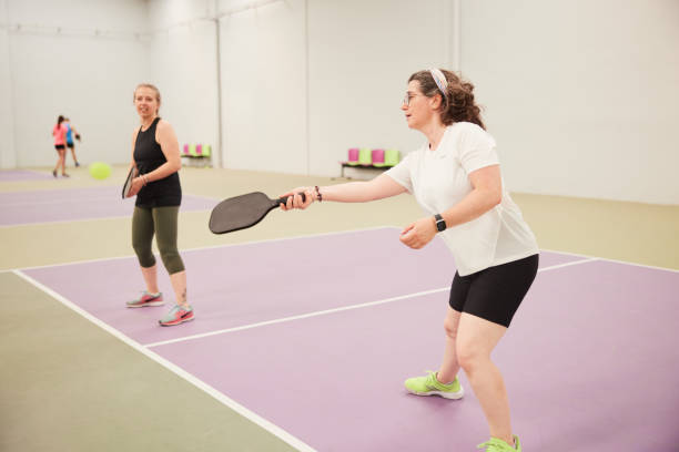 istock A mature woman hits a pickleball. 1406673658