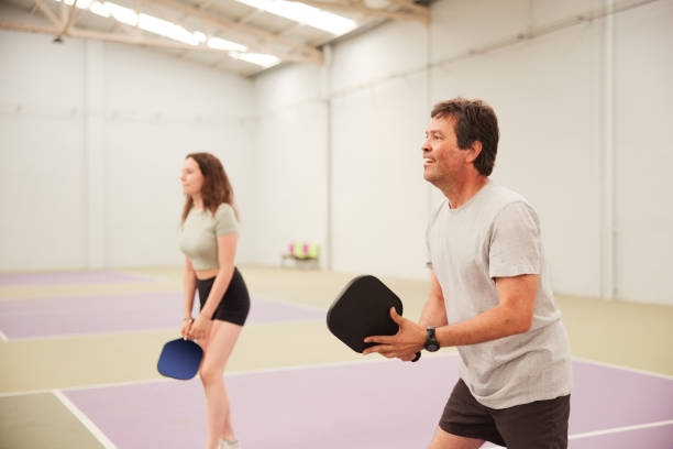 istock Father and daughter are playing Pickleball. 1406673743