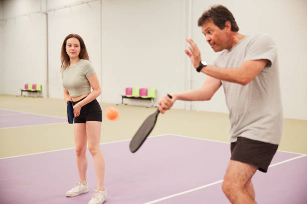 istock Father and daughter are playing Pickleball. 1406673759