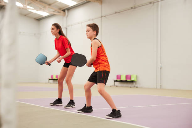 istock Teenagers are playing pickleball. 1406674035