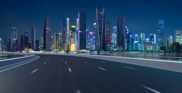 istock Highway overpass motion blur with cityscape skyline 1406674429