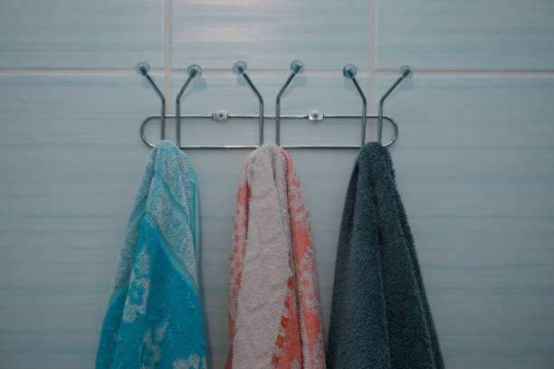 istock Towels hanging in the bathroom, on a blue background. Towel holders. 1406676353