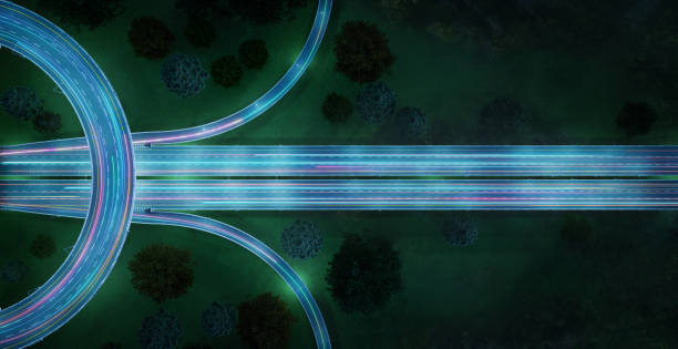 Aerial view of highway with car light trails at night stock photo