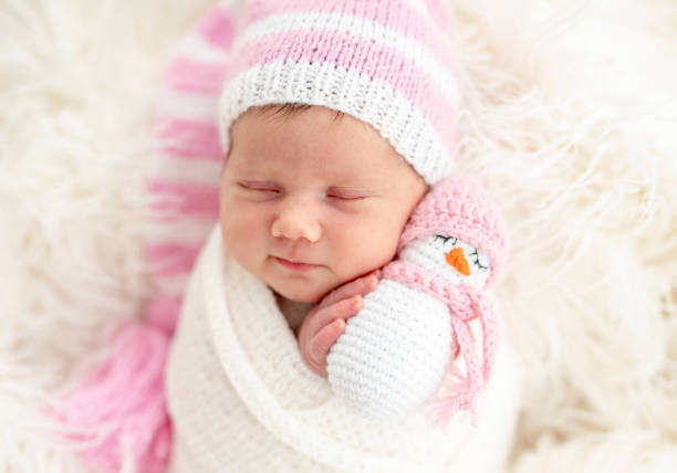 istock Newborn holding toy 1406679190