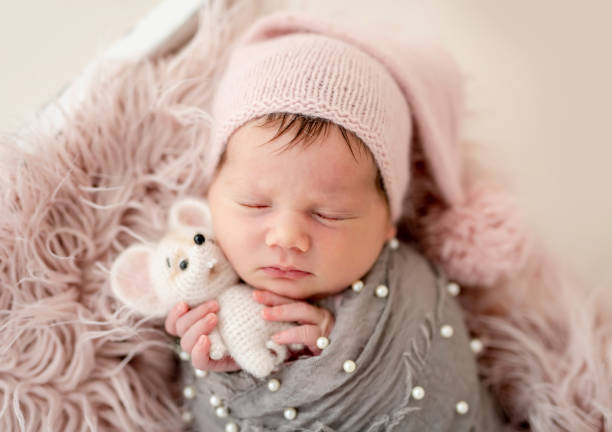istock Cute newborn with toy 1406679211