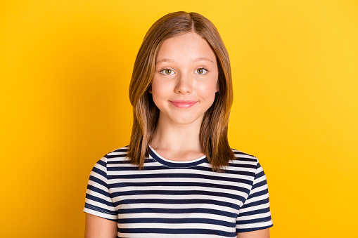 Photo of satisfied school person smile look camera wear striped outfit isolated on yellow color background.