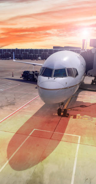 istock Airplane waiting at gate on airport terminal 1406681209