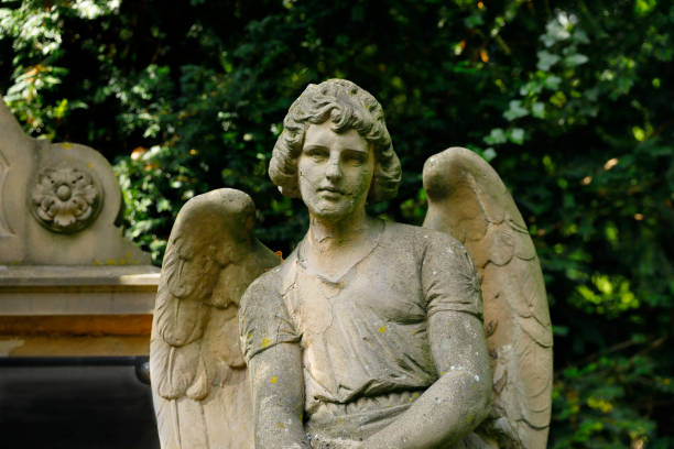 istock Antique Angel statue in a Cemetery 1406681216