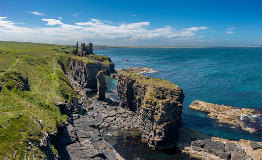 Wick, United Kingdom - 26 June, 2022: high angle view of the Caithness coast and the ruins of the historic Castle Sinclair Girnigoe